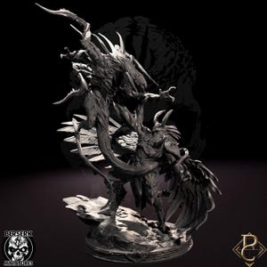May include: A detailed, dark gray miniature sculpture of a fantastical creature with multiple limbs, horns, and wings. The sculpture is on a rocky base, with the "BERSERK MINIATURES" logo in the lower left corner. The overall design is intricate and detailed.