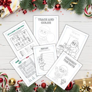 Może przedstawiać: Kolekcja białych książeczek z zadaniami świątecznymi z czarnymi rysunkami liniowymi. Tytuły to "Let's Count: Christmas", "Trace and Color", "Warm Wishes", "Wish List" i "Connect the Dots". Książki otoczone są świątecznymi dekoracjami.