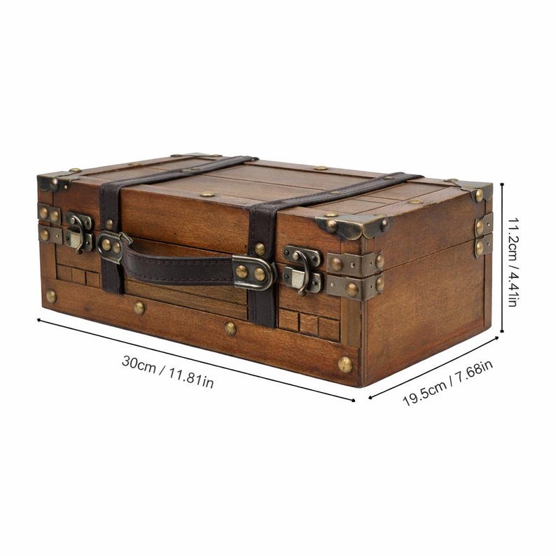 May include: A rectangular wooden trunk with dark brown leather straps and handle. The trunk has metal corner protectors and clasps. Dimensions are 11.81 inches long, 7.68 inches wide, and 4.41 inches high.