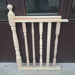 May include: A light-colored wooden staircase railing section featuring a large decorative newel post on the left and five distinct vertical balusters. The components are numbered one through nine, with horizontal rails at the top and bottom.
