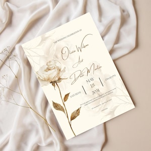 May include: Wedding invitation with floral accents. The invitation features the names "Olivia Wilson and Dave Martin", the date "May 18, 2031", and the time "09:00 PM". The design includes a watercolor rose and botanical elements.