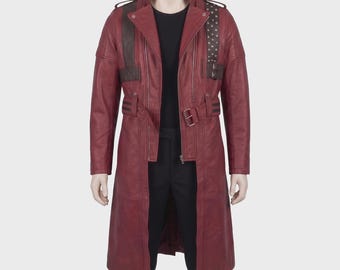 May include: A burgundy leather coat with a long, tailored design. The coat features a notched collar, multiple pockets, and a belt at the waist. Dark brown accents and studded shoulder straps add detail. The coat is displayed on a mannequin.