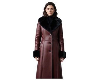 May include: A burgundy leather coat with black faux fur trim on the collar and cuffs. The long coat has a button-down front and a tailored fit. The model is wearing a black turtleneck underneath the coat.