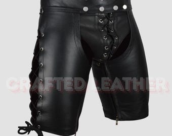 May include: Black leather shorts with a lace-up front and side detailing. The shorts have a zipper closure on the side and silver button accents on the waistband. The text "CRAFTED LEATHER" is visible on the bottom of the shorts.