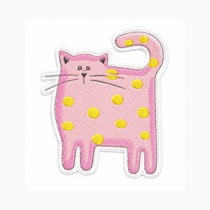 May include: An embroidered patch shaped like a stylized cat with a pink body and yellow polka dots. The cat has a rounded rectangular body, a curved tail, pointed ears, and black stitched details for the eyes, nose, and long whiskers.