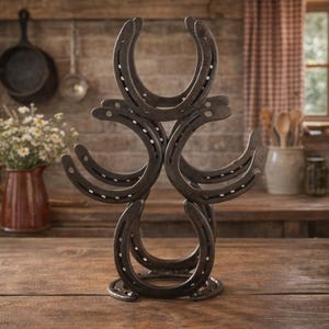 May include: A set of three ceramic mugs with a speckled, matte finish. The mugs are in shades of cream, light gray, and dark gray. Each mug has a simple, minimalist design and a rounded handle. Perfect for coffee or tea.