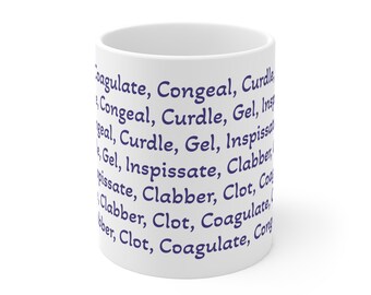 May include: White ceramic mug with dark blue text wrapping around the exterior. The text includes words like "Coagulate", "Congeal", and "Curdle". The mug is cylindrical and appears to be empty.