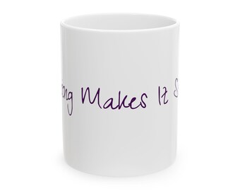 May include: White ceramic mug with the purple text "Nothing Makes It S". The mug is cylindrical and has a glossy finish. The text is written in a cursive font.