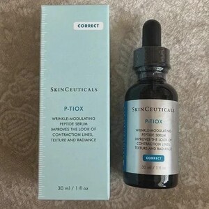 May include: A skincare product set featuring a dark glass bottle with a dropper and a light blue box. The bottle and box display the "SkinCeuticals" brand and "P-Tiox" wrinkle-modulating peptide serum. The box and bottle both read "Correct". The bottle contains 30 ml / 1 fl oz.