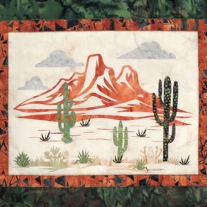 May include: A white fabric panel with a red mountain range and green cacti against a white background. The panel has a brown and green border.