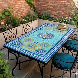 May include: A rectangular dining table with a mosaic tile top featuring intricate geometric patterns in shades of turquoise, blue, and yellow, supported by a black metal frame, accompanied by four matching black metal chairs with teal cushions.