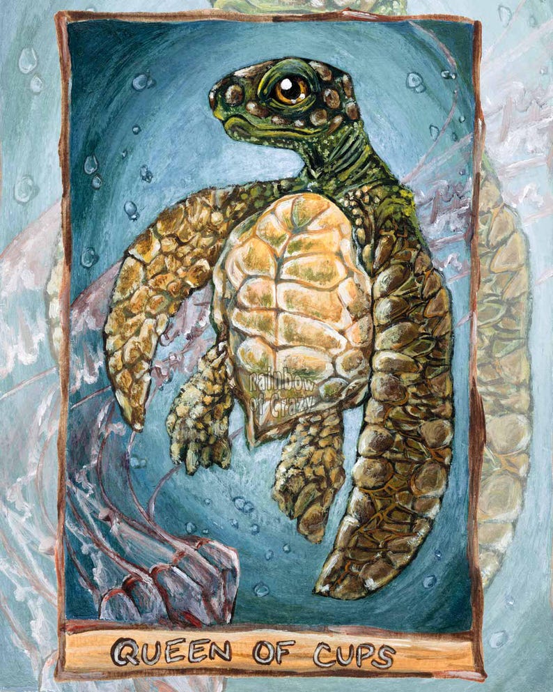 May include: An artistic illustration of a sea turtle, with a light brown and green shell, swimming in blue water. The image is framed with a wooden border and includes the text "QUEEN OF CUPS".