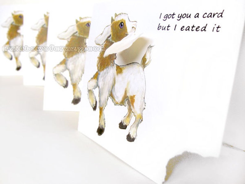 May include: A series of white greeting cards with a watercolor illustration of a goat. The goat is brown and white, with the text "I got you a card but I eated it". The website rainbowofcrazy.com is also visible.