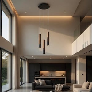May include: Modern pendant light fixture with three cylindrical shades. The shades are a combination of dark wood and black metal, suspended from a circular black ceiling mount. The fixture hangs in a contemporary living space with large windows and neutral tones.