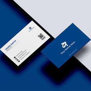 May include: Two business cards, one white and one blue, are displayed at an angle against a blue and white background. The white card features the name "JAMES SMITH" and contact information. The blue card has the text "Your Name Here" and a website address.