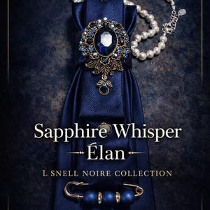 May include: A navy blue necktie featuring a large oval blue gemstone brooch with gold filigree, a pearl necklace, and a gold safety pin adorned with three blue beads. Text reads: Sapphire Whisper Élan L SNELL NOIRE COLLECTION.