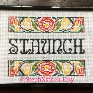 May include: A framed cross-stitch design with a black frame and white background. The design features a floral border with red, yellow, and green flowers. The word "SILAUNCH" is stitched in black in the center of the design. The bottom of the design includes the text "@StephXStitch.Etsy".