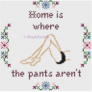 May include: Cross-stitch pattern with a floral border and the text "Home is where the pants aren't". The design features a pair of legs in a relaxed pose.