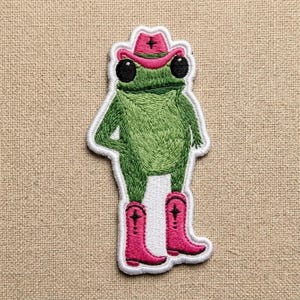 May include: A rustic wooden sign with the text "Welcome to our home" in white lettering. The sign features a distressed finish and a simple, inviting design, perfect for a front porch or entryway.