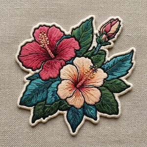 May include: A set of three ceramic nesting bowls in graduating sizes. The bowls are white with a speckled, textured finish and a slightly flared rim. The largest bowl is approximately 8 inches in diameter.