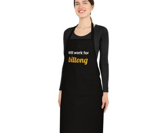 May include: A black apron featuring the white text "Will work for" above the yellow text "biltong" centred on the chest area. The apron has a neck loop and waist ties, providing full front coverage for the torso while maintaining a simple design.