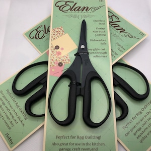 May include: Black Elan scissors with a non-stick coating, perfect for rag quilting. The packaging includes text that says "Perfect for Rag Quilting!" and "Also great for use in the kitchen, garage, craft room and anywhere a heavy-duty utility scissor is needed!"