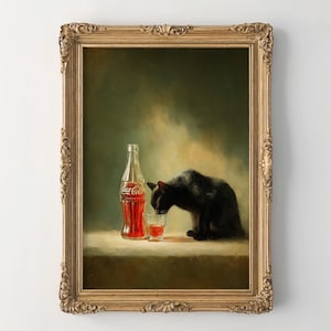 May include: A framed art print featuring a black cat, a Coca-Cola bottle, and a glass of the beverage. The bottle and glass are filled with a red liquid. The artwork has a vintage aesthetic with a gold ornate frame.