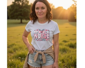 Pink Cute Nurse Graphic T-Shirt | Nurse Lettering with Hearts & Medical Icons. Comfort Colors
