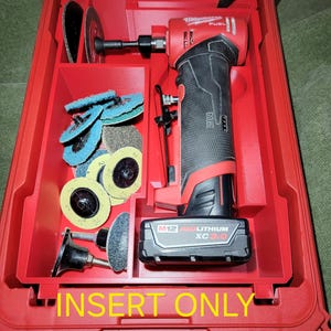 May include: Red tool case with compartments holding a red and black power tool, various sanding discs, and a battery. The case is open, revealing the contents. The text "INSERT ONLY NO TOOLS!" is visible.