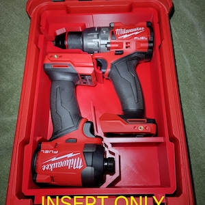 May include: Red Milwaukee power tool case with two power tools inside. The case has the text "SHIPS FREE", "INSERT ONLY", and "NO TOOLS!" in yellow. The tools are red and black.
