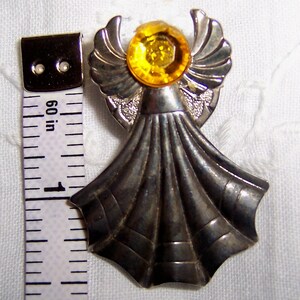 Vintage angel pin with yellow rhinestone. Silver metal. image 1