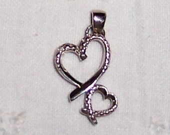 Vintage 2 Hearts Pendant. Silver plated.