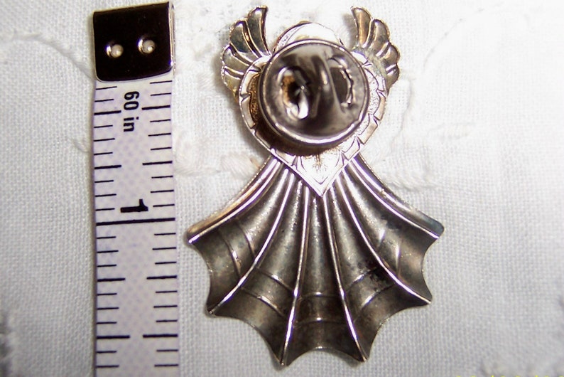 Vintage angel pin with yellow rhinestone. Silver metal. image 2