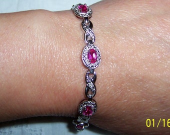 Vintage lab created pink sapphire or ruby bracelet. Sterling silver.
