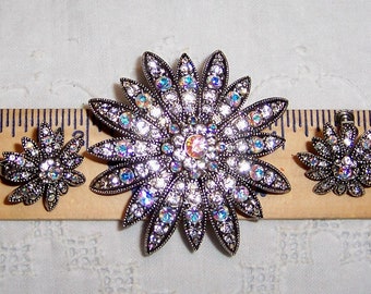 Vintage AB rhinestones flower brooch and earrings set. Silver metal. Joan Rivers signed.