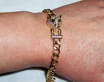 Vintage white and green cubic zirconias panther bracelet. Yellow gold plate. Never used.