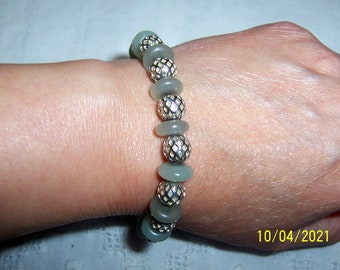 Your choice of green bracelet. Sterling silver.