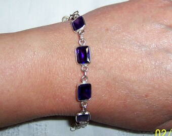 Vintage emerald cut purple cubic zirconias bracelet. Sterling silver. Signed.