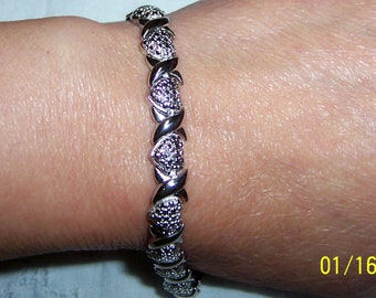 Vintage hearts and X bracelet, one diamond accent. Silver plated.