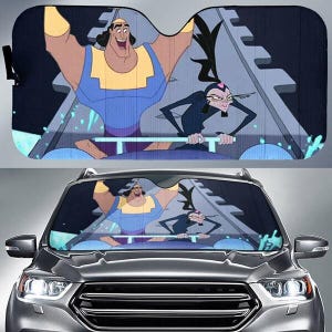 May include: A car sunshade featuring a cartoon image of two characters in a boat. The sunshade is black with a colorful graphic of the characters in a boat on a gray background. The sunshade is displayed in the windshield of a gray car.