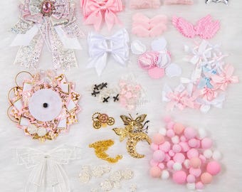 May include: A selection of premium decorative charms and embellishments. The image shows bows, wings, stars, and floral accents in pink, white, and gold. The text "Premium Decorative Charms & Embellishments" is at the bottom of the image.