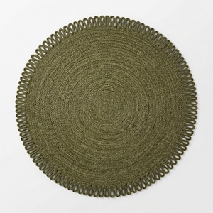 May include: A circular olive green woven placemat featuring a tightly coiled centre and a decorative outer border composed of a continuous series of small, uniform loops. The texture is consistent throughout the entire round surface.