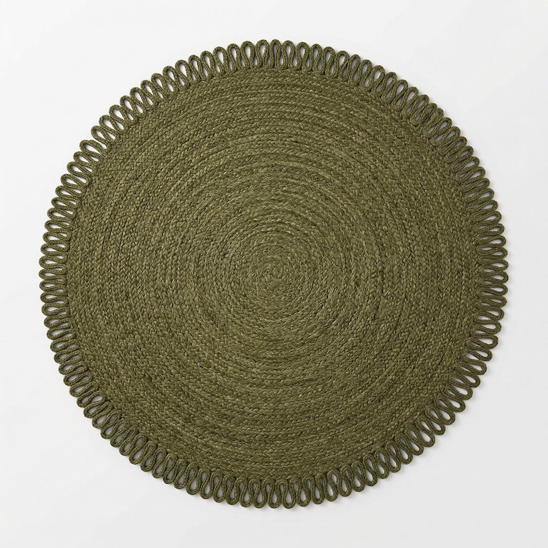 May include: A circular olive green woven placemat featuring a tightly coiled centre and a decorative outer border composed of a continuous series of small, uniform loops. The texture is consistent throughout the entire round surface.