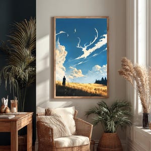 May include: A framed wall art print depicting a golden wheat field under a bright blue sky with white clouds. A silhouette of a person stands in the field, while a large, ethereal white deer shape is formed by clouds in the sky above the horizon.