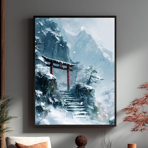 May include: Framed art print depicting a snowy Japanese landscape. A red torii gate stands atop a snow-covered cliff, with a stone staircase leading up to it. The background features snow-covered mountains and falling snow, creating a serene winter scene.
