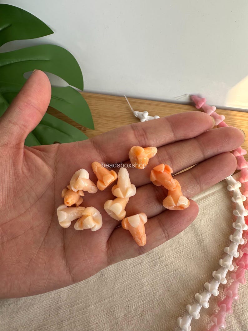 variegated orange puakenikeni flower beads