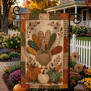 May include: A rectangular garden flag featuring a quilted-style design with a central turkey wearing a bow tie, surrounded by three pumpkins and autumn foliage. The border consists of various patchwork patterns in shades of brown, green, and orange.