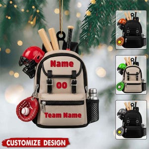 May include: A beige backpack ornament featuring red text that reads Name, 00, and Team Name. The backpack is decorated with a red baseball helmet, a red baseball glove with a white ball, two wooden baseball bats, and a silver water bottle.