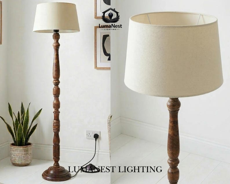 May include: A wooden floor lamp with a beige lampshade. The lamp has a dark brown, ornate base and a tall, carved wooden pole. The lampshade is a neutral color, and the lamp is plugged into a wall outlet. The text "LumaNest Lighting" is visible.
