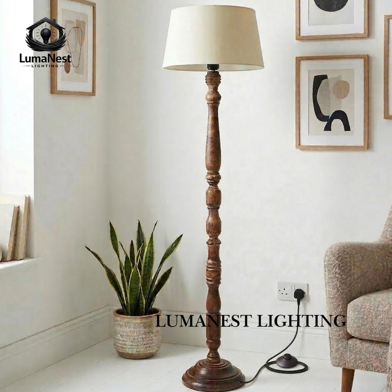 May include: A wooden floor lamp with a beige lampshade. The lamp has a dark brown, carved wooden base and stem. A potted snake plant sits nearby. The text "LumaNest Lighting" is visible on the image.